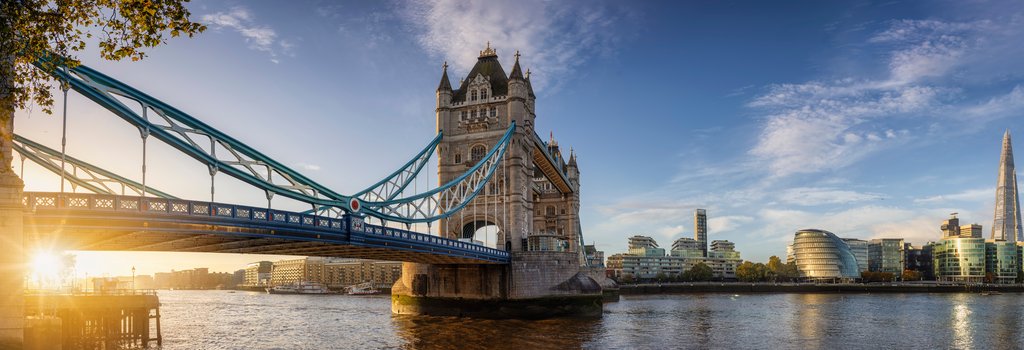 View of tower bridge across the Thames with the sun shining